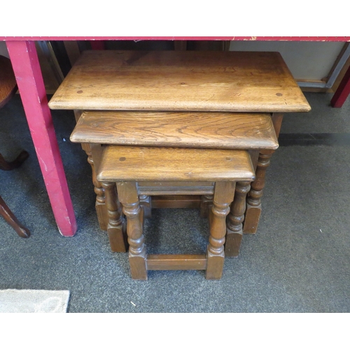 1051 - An Old Charm oak nest of three side tables, largest 45cm tall x 60cm long x 37cm wide