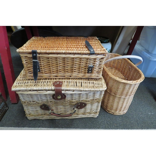 1070 - Two wicker hampers and a wicker stair basket (3)