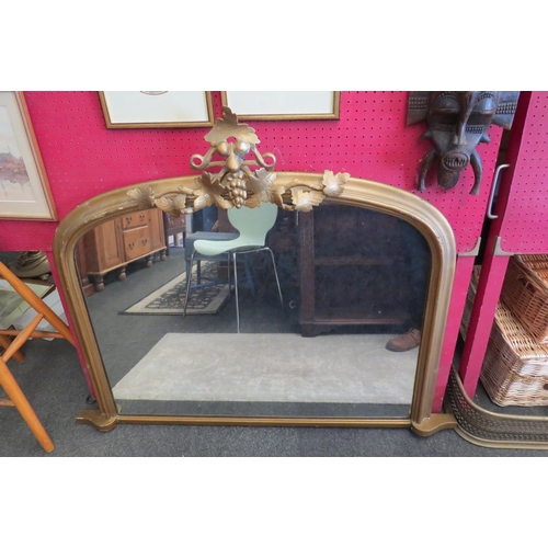 1076 - A gilt and gesso overmantel mirror with applied grapevine detail, 98cm x 125cm