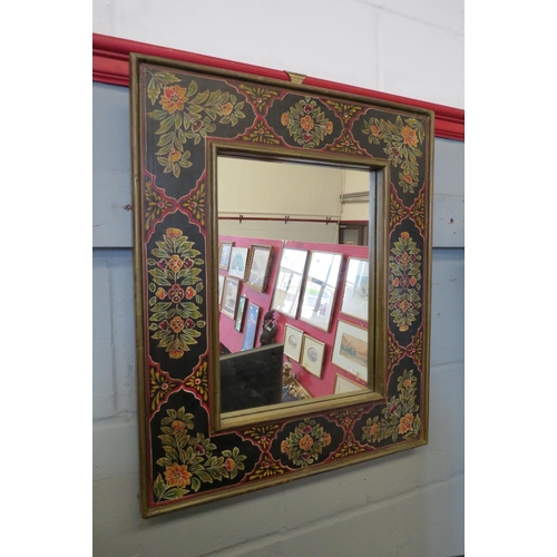 1084 - A 20th Century hand painted mirror with floral decoration, 60cm x 50cm