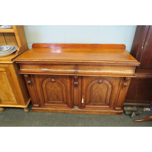 1087 - A Victorian mahogany sideboard, two cushion drawers over two cupboard door bases, loss to moulding, ... 