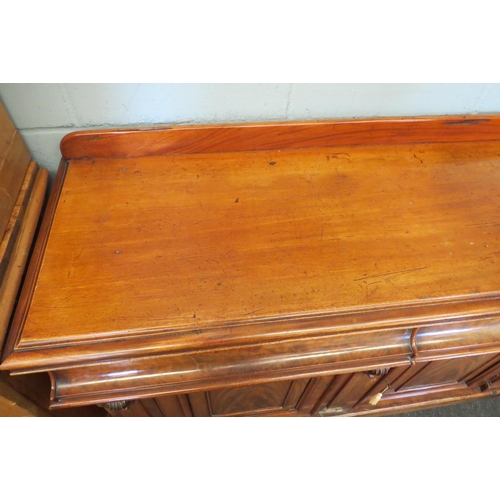 1087 - A Victorian mahogany sideboard, two cushion drawers over two cupboard door bases, loss to moulding, ... 