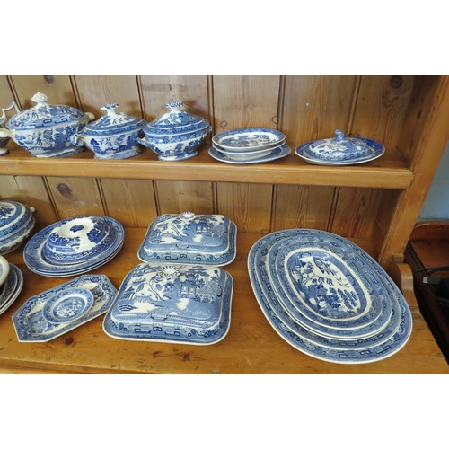 1090 - A collection of Willow pattern blue and white ceramics including Wedgwood and Ridgways jugs, dishes,... 