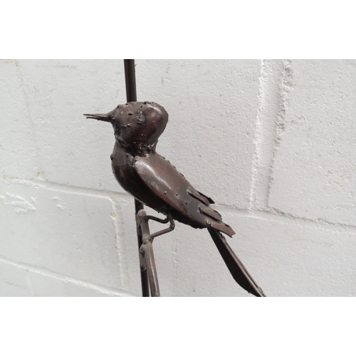 1092 - A pricket candle stand with bird design, 110cm tall