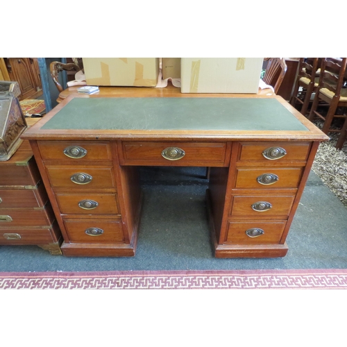 1100 - A circa 1900 walnut twin pedestal desk, nine drawer front set with brass handles, on plinth base, 76... 