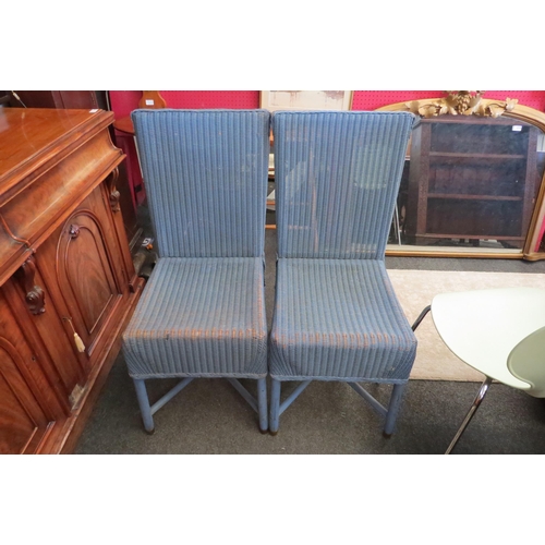 1104 - A pair of 1940's Lloyd Loom Lusty dining chairs, one with original paper label