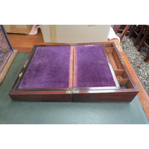 1105 - A Victorian rosewood writing box with cartouche to lid and purple velvet interior