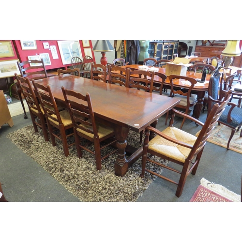 1120 - A reproduction country oak refectory dining table in the Jacobean style, plank top over heavy turned... 