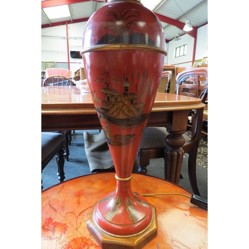 1126 - An Oriental red painted tin table lamp base with black shade