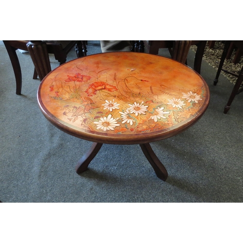 1127 - A leather embossed coffee table marked David 2001 to top, 44cm tall x 60cm diameter