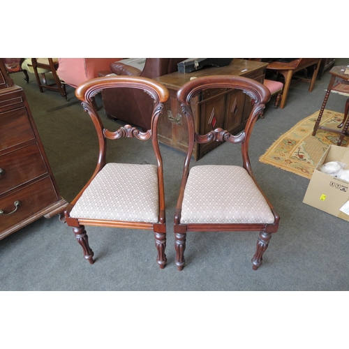 1130 - A set of ten Victorian and later mahogany buckle-back dining chairs, carved scrolled foliate design,... 