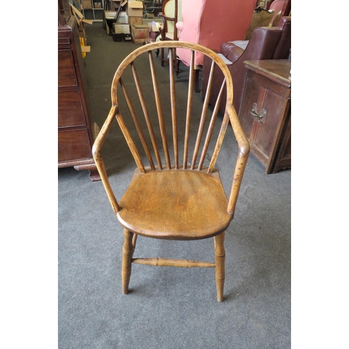 1132 - A 19th Century primitive country Windsor hoop and stick back elbow chair, elm seat, turned supports ... 