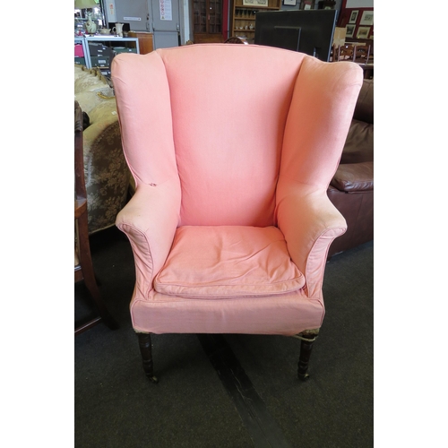 1151 - A 19th Century wingback armchair