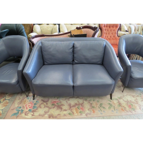 1159 - A blue leather three piece designer suite comprising of two seater sofa and a pair of matching chair... 