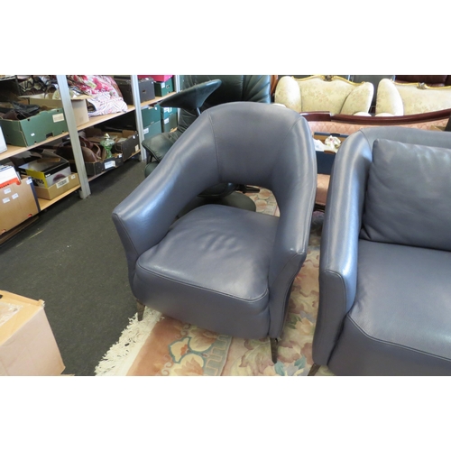 1159 - A blue leather three piece designer suite comprising of two seater sofa and a pair of matching chair... 