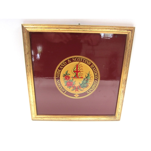 8179 - A framed wooden backed transfer print of London Midland & Scottish Company crest, 34 x 34cm