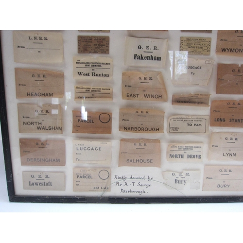 8200 - A framed and glazed display of various luggage labels and tickets, mostly relating to GER, LNER and ... 