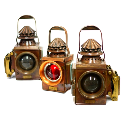 8232 - A set of three copper traction engine lamps, front pair with flared bulbous lenses and L/H and R/H s... 