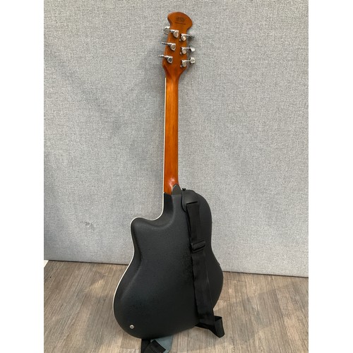 1268 - A Westfield SR-382 electro-acoustic guitar, plastic back, sunburst body, hard cased