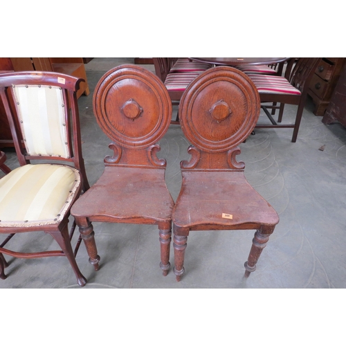 2178 - A pair of Victorian oak hall chairs