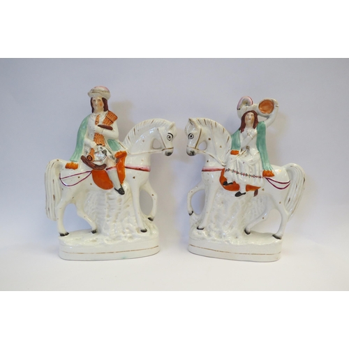 1001 - A pair of Victorian Staffordshire figures on horseback, 28cm tall