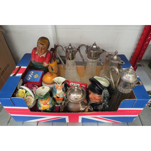 1212 - A box of assorted items including OXO tins, four moulded glass decanters with plated rims, carved wo... 