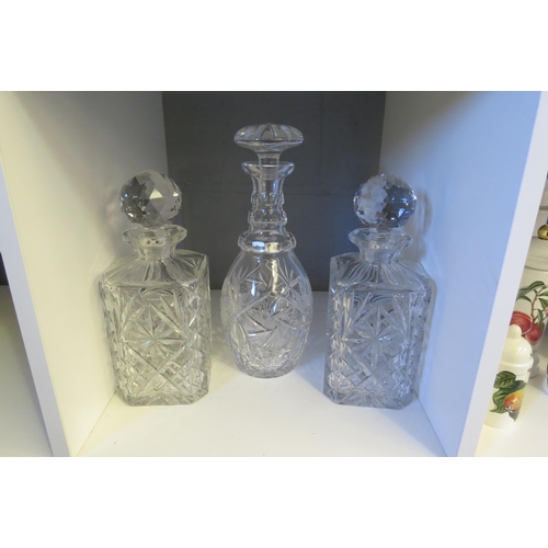 1245 - Three cut/moulded glass decanters and stoppers.  Tallest 29cm