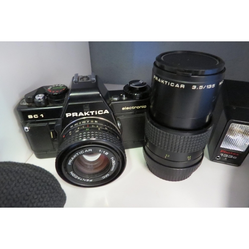 1263 - A Praktica Pentacon BC1 50mm lens camera and a Praktica Carl Zeiss Gena 3.5/135 MC lens with other a... 