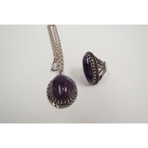 1284 - A matching unmarked silver and amethyst ring and necklace stamped 925