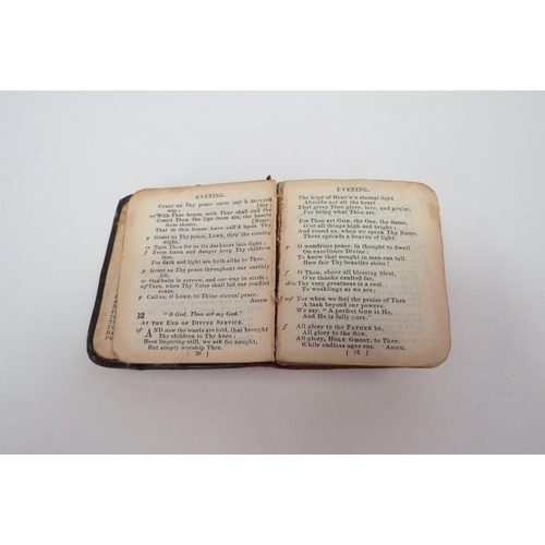 1294 - A miniature antique silver fronted Hymn book, with angel decoration.  Birmingham 1904