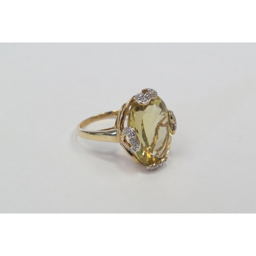 1296 - A 9ct gold citrine and diamond set ring.  Approximately 4.8g