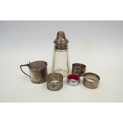 1312 - A small quantity of silver wares including sugar caster and napkin rings