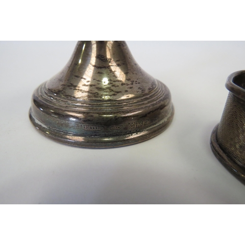 1319 - Two silver squat candle sticks and a napkin ring