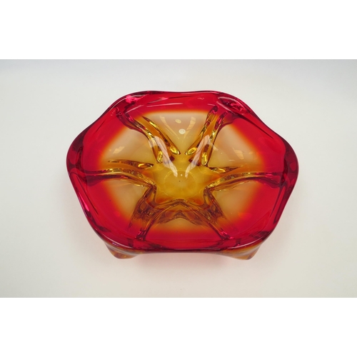 1327 - A heavy Art Glass bowl in red and yellow, 23cm diameter