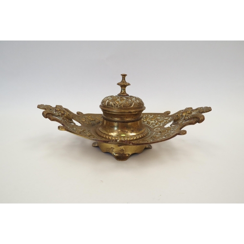 1331 - A Victorian decorative brass inkwell with glass liner