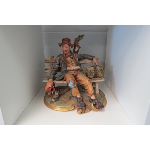 1339 - A Capodimonte figural group 'The Tramp', 25cm tall     (Group)