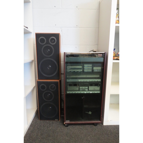 1363 - An Amstrad hifi system in cabinet, comprising turntable, amplifier, tuner, twin cassette deck and sp... 