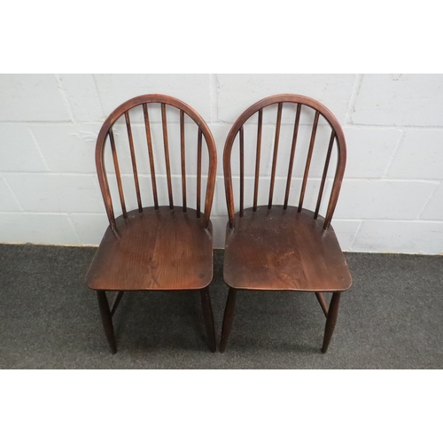 1041 - A pair of oak stick back country chairs