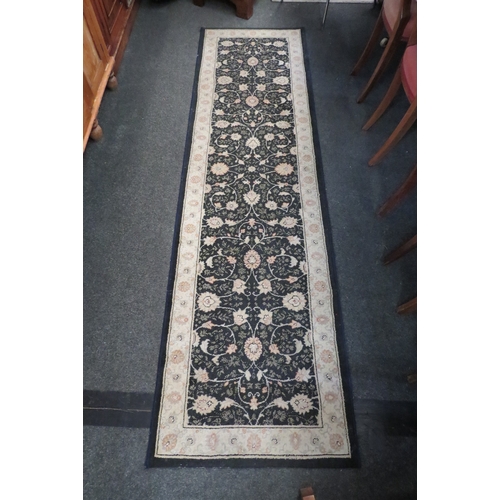 1107 - A Mastercraft Belgian polypropylene blue and cream ground runner rug with floral design, 67cm x 240c... 