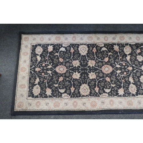 1107 - A Mastercraft Belgian polypropylene blue and cream ground runner rug with floral design, 67cm x 240c... 