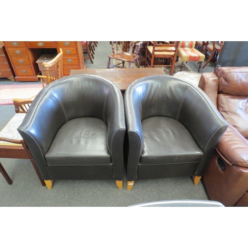 1146 - Two black leather tub chairs