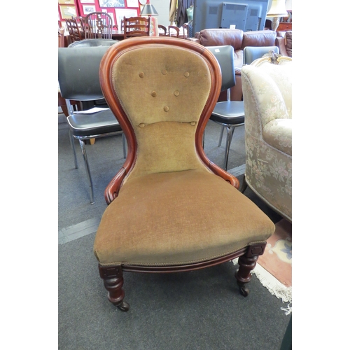 1160 - A circa 1860 mahogany spoon-back armchair with button backrest over turned fore legs and ceramic cas... 