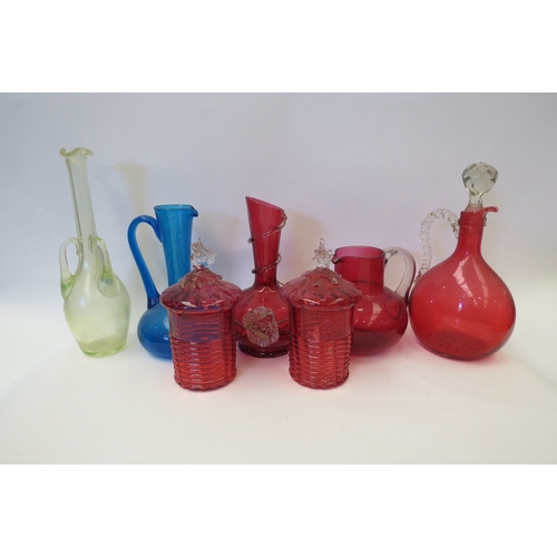 1419 - A quantity of coloured glass including cranberry jugs (7)