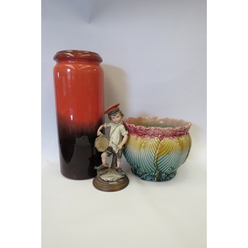 1435 - A large West German vase, 42cm tall, together with a majolica jardiniere and an Italian figure of dr... 