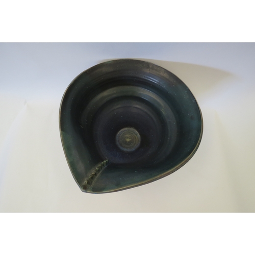 1438 - A Studio Pottery abstract form bowl, 16cm tall   (R) £20