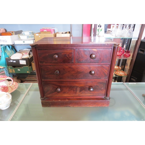 1444 - A circa 1830 mahogany table-top collector's chest of two short over three long drawers with purchase... 