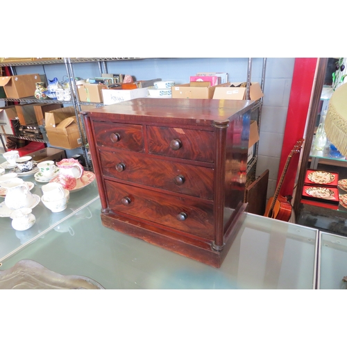 1444 - A circa 1830 mahogany table-top collector's chest of two short over three long drawers with purchase... 