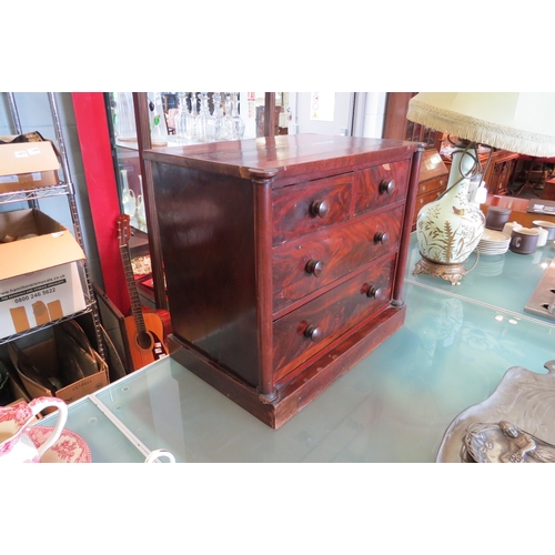 1444 - A circa 1830 mahogany table-top collector's chest of two short over three long drawers with purchase... 