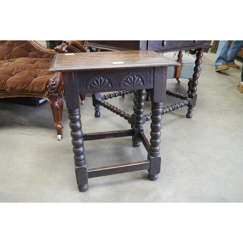 2002 - A Jacobean style oak joined stool with lunette carved frieze