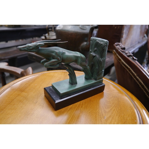 2010 - An Art Deco verdigris cold painted bronze glazed book end on marble signed M. Le Verrier